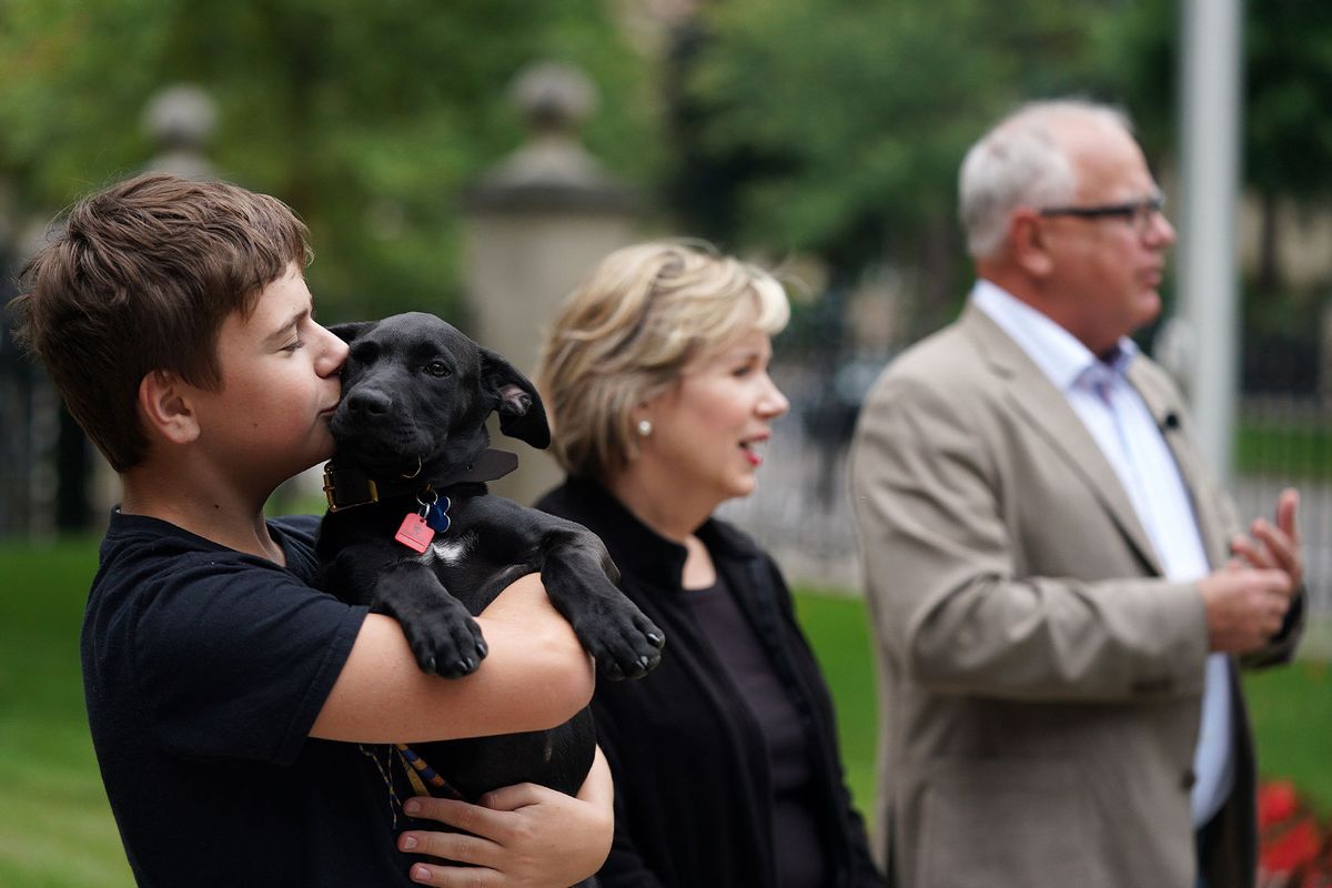 Governor Tim Walz, First Lady Gwen Walz, and their son Gus, introduced the newest addition to their family, Scout, a 3-month-old Labrador Retriever mix they adopted a few days prior from Midwest Animal Rescue & Services, during a press conference Thursday, September 5, 2019 at the Governor's Residence in St. Paul, Minn. (Star Tribune via Getty Images)