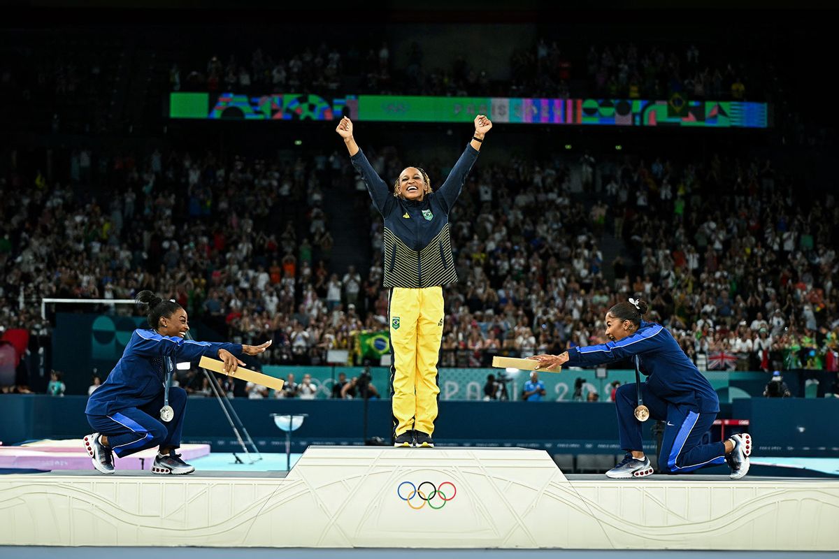 US' Simone Biles (silver), Brazil's Rebeca Andrade (gold) and US' Jordan Chiles (bronze) pose during the podium ceremony for the artistic gymnastics women's floor exercise event of the Paris 2024 Olympic Games at the Bercy Arena in Paris, on August 5, 2024. (GABRIEL BOUYS/AFP via Getty Images)