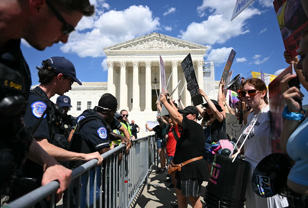 US Supreme Court Police officers put up barricades to separate anti-abortion activists (R) from aborton rights activists during a demonstration in front of the Supreme Court in Washington, DC, on June 24, 2024. (Jim Watson/AFP via Getty Images)