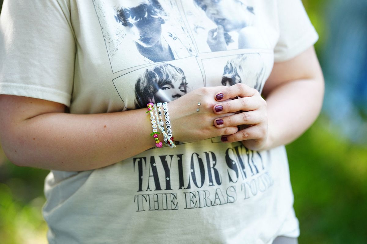 A fan of US mega-star Taylor Swift wears a t-shirt with her star during the "Taylor Swift The Eras Tour Picnic" on August 7, 2024 in a public garden in Vienna, Austria, prior to her three scheduled concerts. (EVA MANHART/APA/AFP via Getty Images)