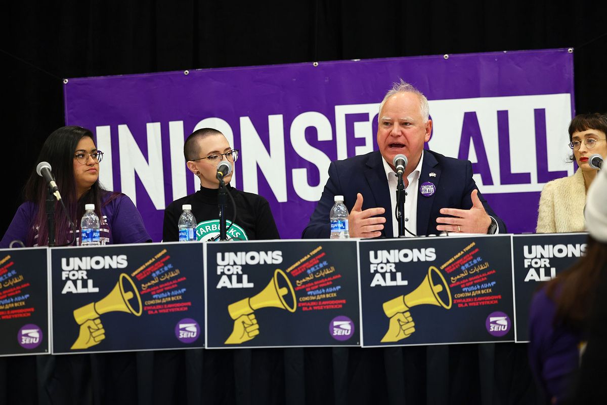 Minnesota Governor Tim Walz speaks with union organizers before they march on businesses in downtown Minneapolis on October 14, 2022 in Minneapolis, Minnesota. (Adam Bettcher/Getty Images for SEIU)