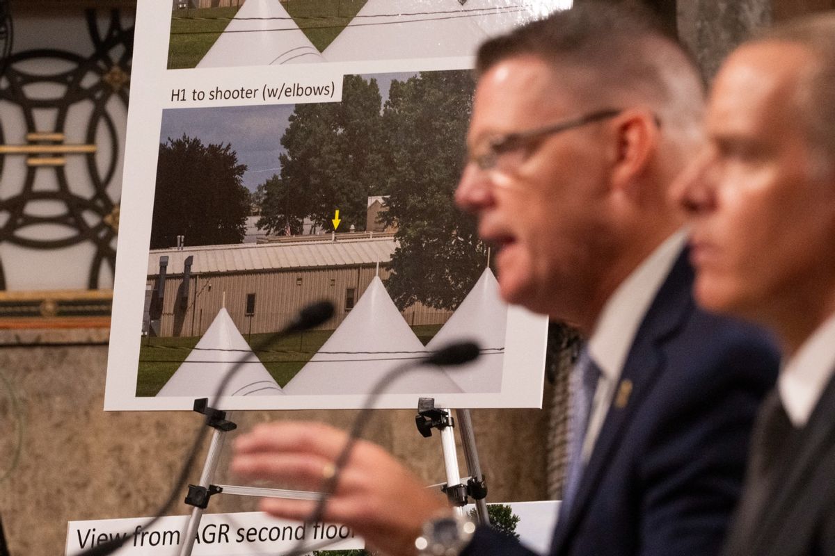 U.S. Secret Service Acting Director Ronald Rowe, Jr. (2nd R), and FBI Deputy Director Paul Abbate show a photo of the shooter's position as they testify during a U.S. Senate Homeland Security and Governmental Affairs and Senate Judiciary joint committee hearing on the security failures leading to the assassination attempt on former U.S. President Donald Trump, at the U.S. Capitol in Washington, DC, on July 30, 2024. (ROBERTO SCHMIDT/AFP via Getty Images)