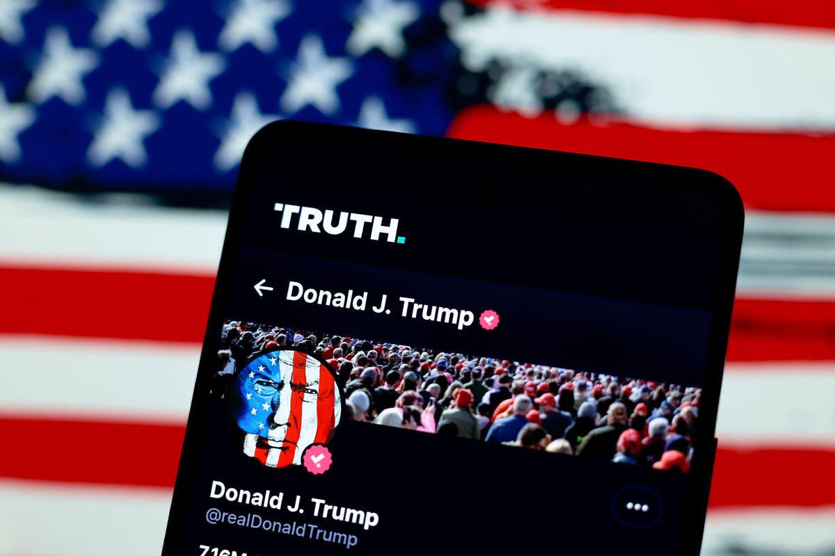 The official profile of the former president of the United States Donald John Trump, seen on the social network Truth and in the background, the flag of the United States. (Jaque Silva/SOPA Images/LightRocket via Getty Images)