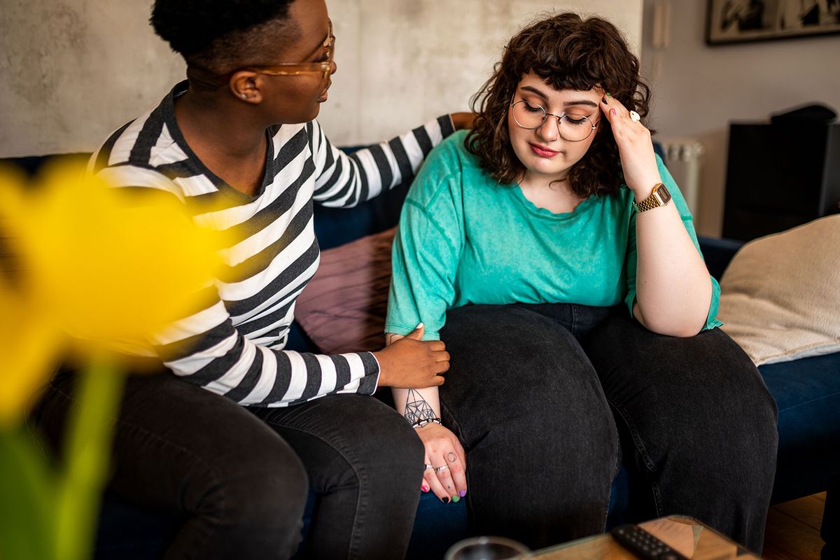 Woman comforting her friend (Getty Images/MStudioImages)