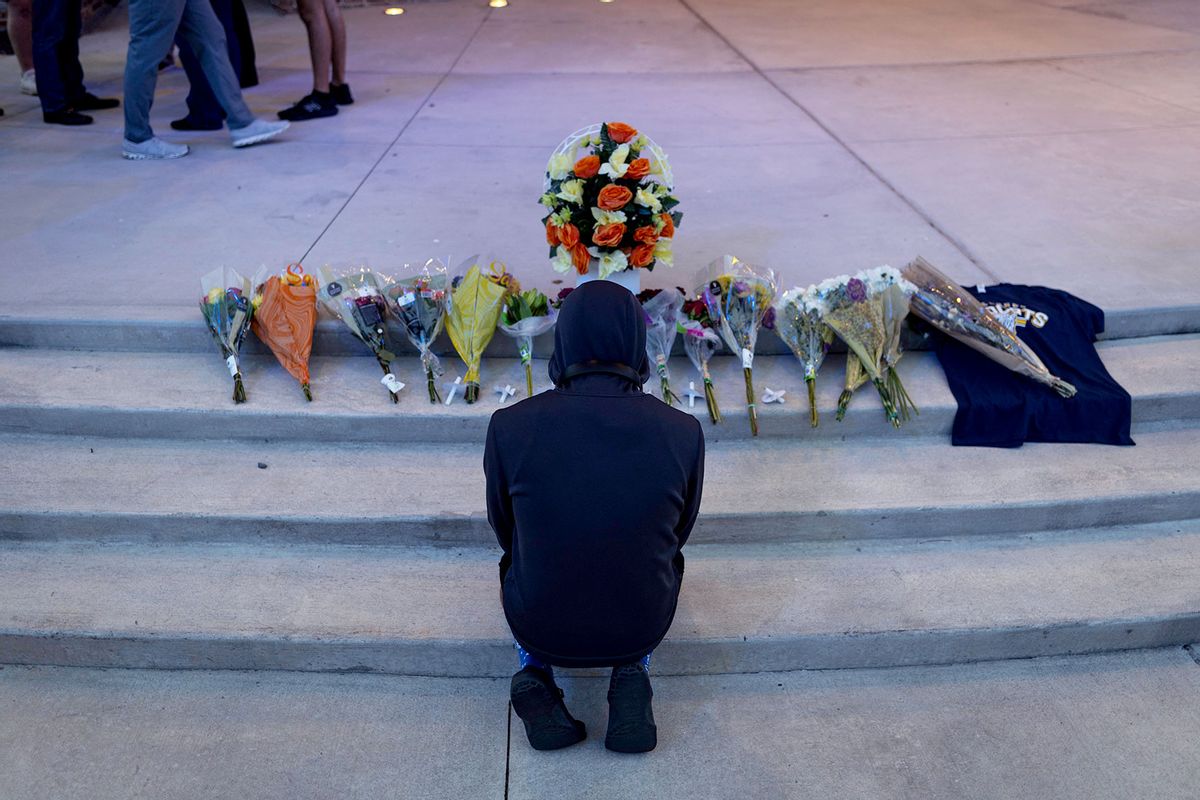 A person prays during a vigil for the victims of the Apalachee High School shooting at Jug Tavern Park in Winder, Georgia, on September 4, 2024. (CHRISTIAN MONTERROSA/AFP via Getty Images)