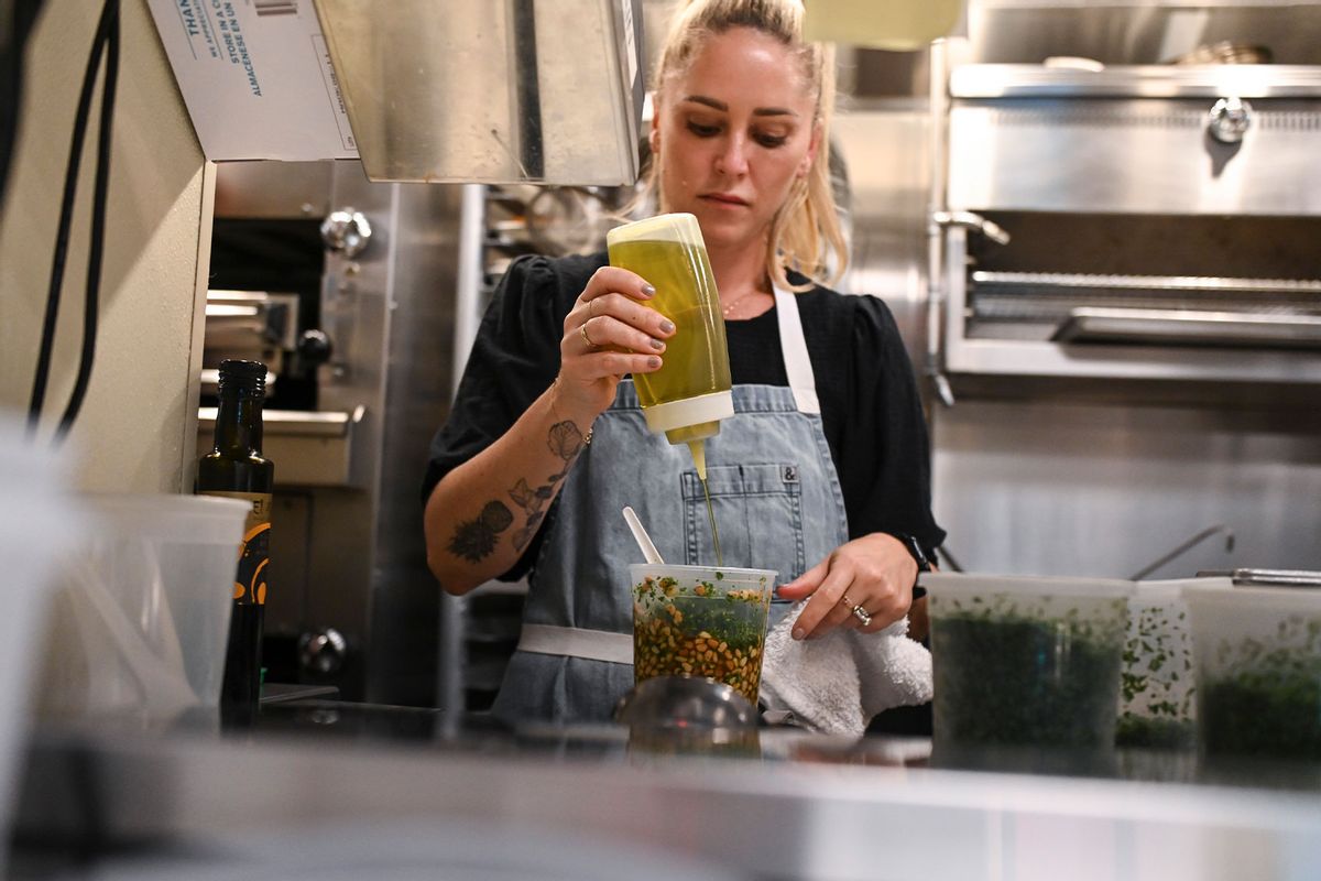 Chef Brooke Williamson prepared food at the Dinner with Antonia Lofaso, Brooke Williamson and Oscar Gonzalez during the Food Network New York City Wine & Food Festival presented by Capital One on October 15, 2022 in New York City. (Daniel Zuchnik/Getty Images for NYCWFF)