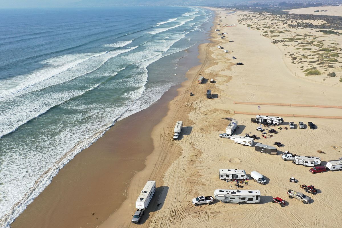 An aerial view of a vehicle recreation area on the beach as Pacific Ocean waves break in a marine area which is part of the proposed Chumash Heritage National Marine Sanctuary, along California’s Central Coast, on September 21, 2023 near Grover Beach, California. (Mario Tama/Getty Images)