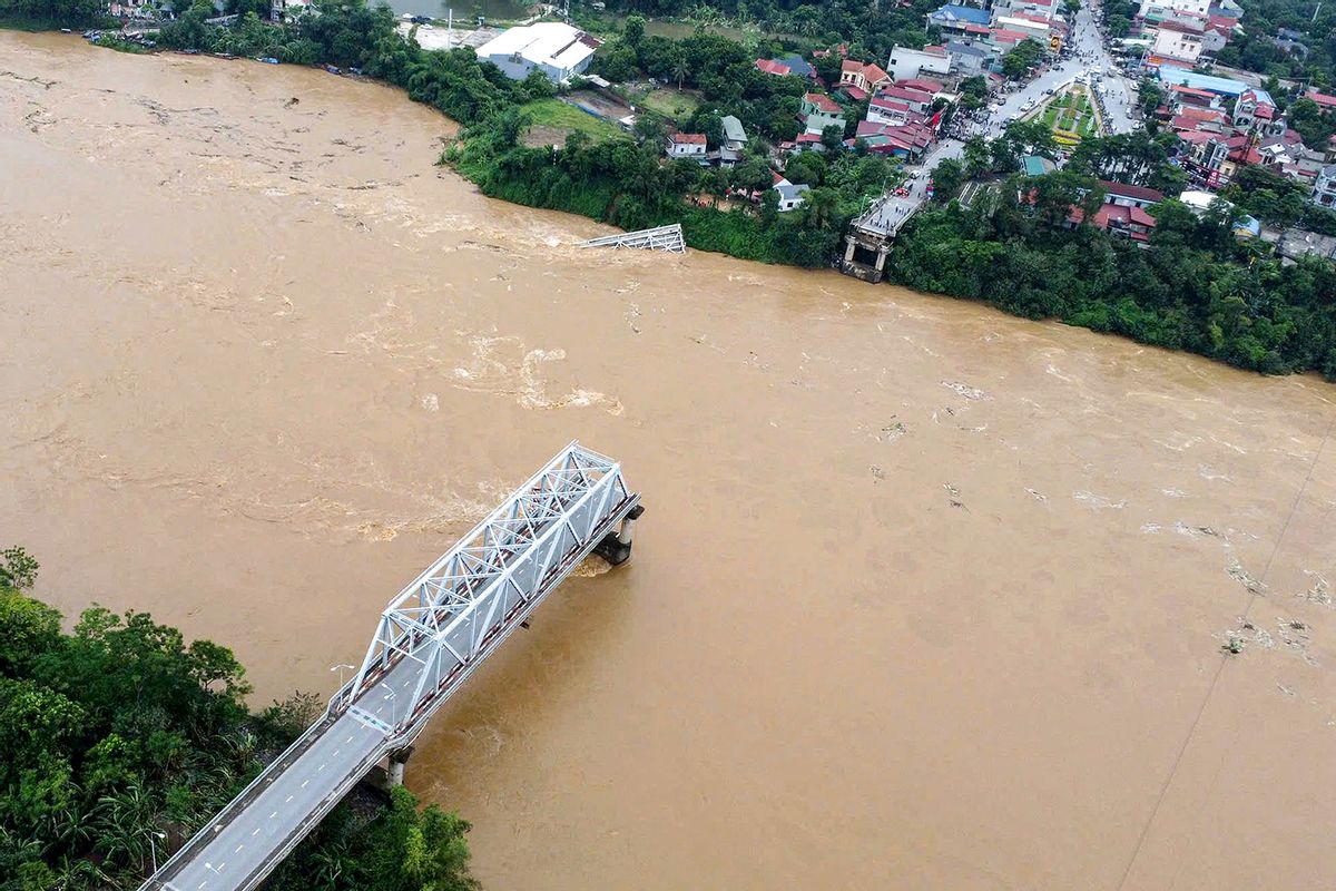 This aerial picture shows the collapsed Phong Chau bridge over the Red River in Phu Tho province on September 9, 2024, after Super Typhoon Yagi hit northern Vietnam. (STR/AFP via Getty Images)