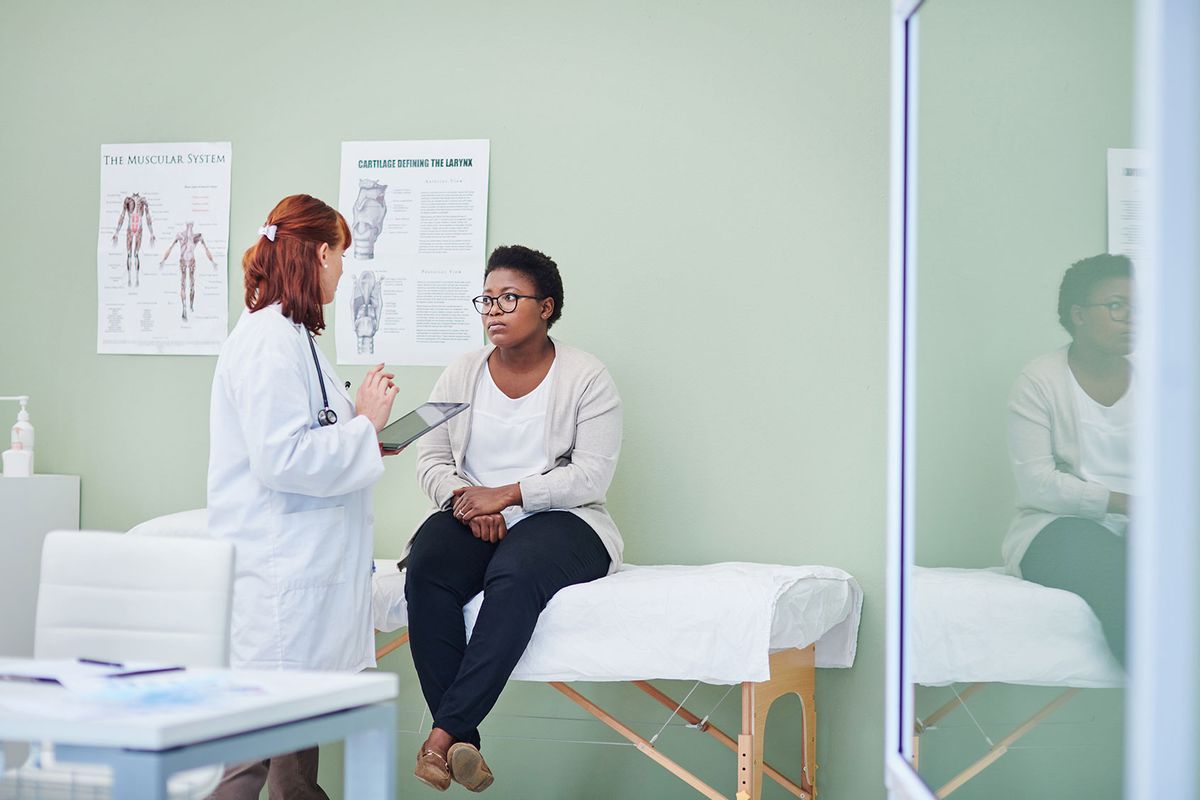 Doctor having a consultation with her patient (Getty Images/LaylaBird)