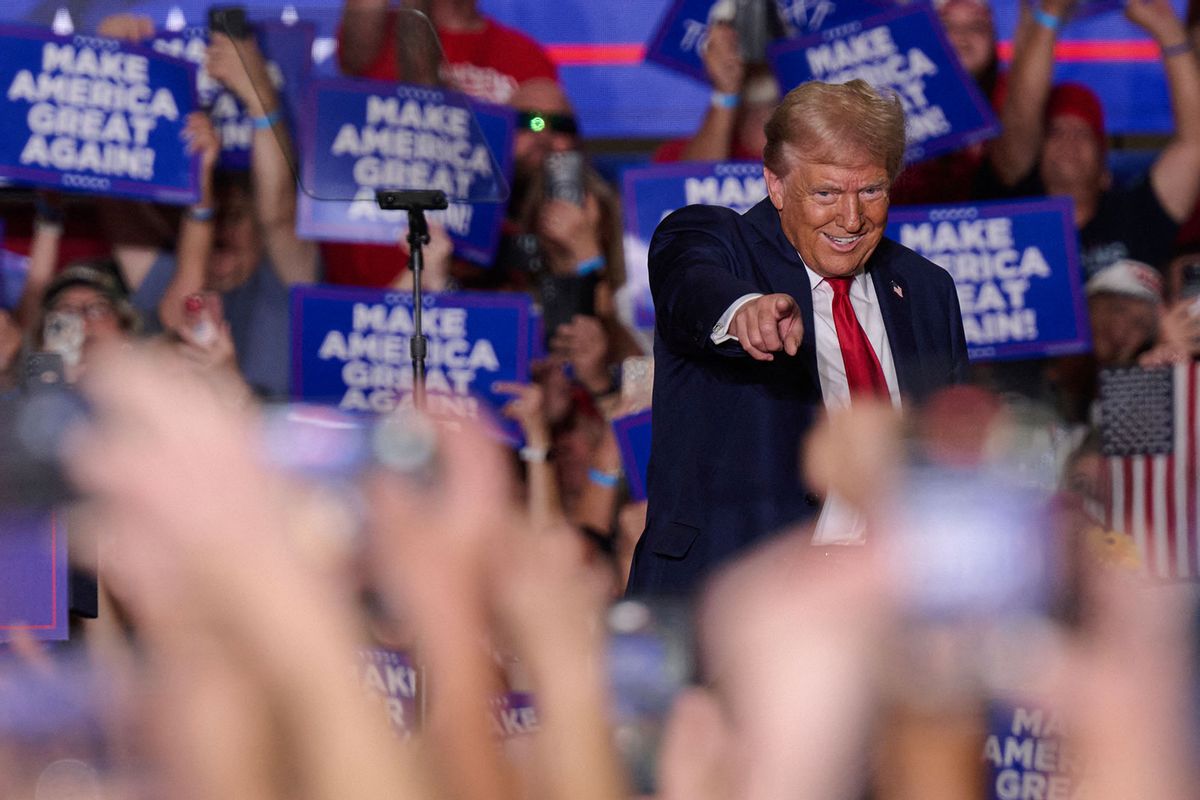 Former US President and Republican presidential candidate Donald Trump gestures to the crowd as he arrives onstage to speak during a campaign event at the Bayfront Convention Center in Erie, Pennsylvania, September 29, 2024. (DUSTIN FRANZ/AFP via Getty Images)