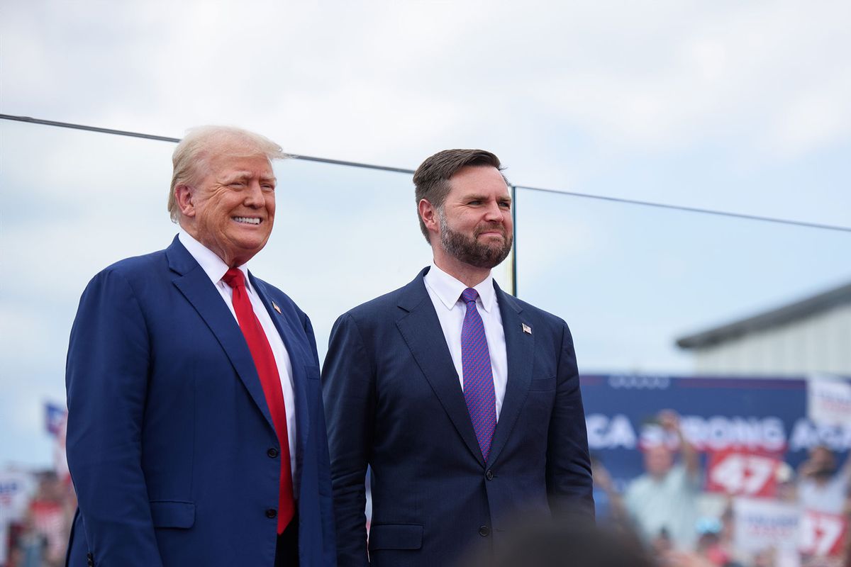 Republican Presidential candidate, former U.S. president, Donald Trump, left, poses for photos with Republican Vice Presidential candidate, U.S. Sen. J.D. Vance, (R-OH), before making remarks to a crowd during an event on August 21, 2024 in Asheboro, North Carolina at the North Carolina Aviation Museum and Hall of Fame. (Melissa Sue Gerrits/Getty Images)