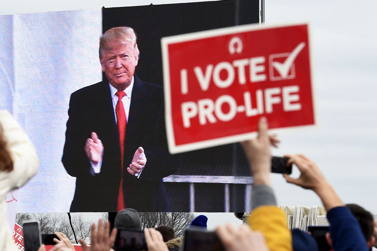 Pro-life demonstrators listen to US President Donald Trump as he speaks at the 47th annual "March for Life" in Washington, DC, on January 24, 2020. (OLIVIER DOULIERY/AFP via Getty Images)