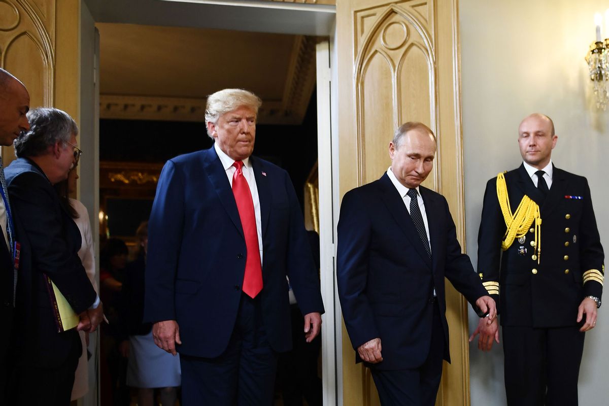 Russian President Vladimir Putin and US President Donald Trump arrive for a meeting in Helsinki, on July 16, 2018. (BRENDAN SMIALOWSKI/AFP via Getty Images)