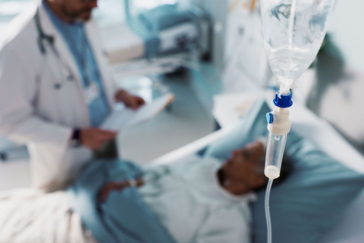 IV drip, healthcare and medicine with doctor and patient in hospital (Getty Images/Jacob Wackerhausen)