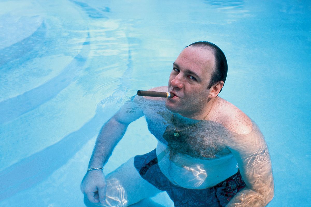 American actor James Gandolfini, as Tony Soprano, smokes a cigar while he stands in pool, in publicity still for the HBO cable TV series 'The Sopranos,' 1999. (Anthony Neste/Getty Images)