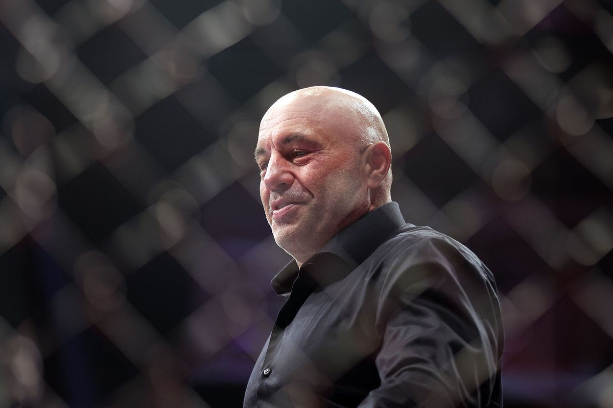 Joe Rogan walks inside the Octagon during the UFC 282 event at T-Mobile Arena on December 10, 2022 in Las Vegas, Nevada. (Carmen Mandato/Zuffa LLC/Getty Images)