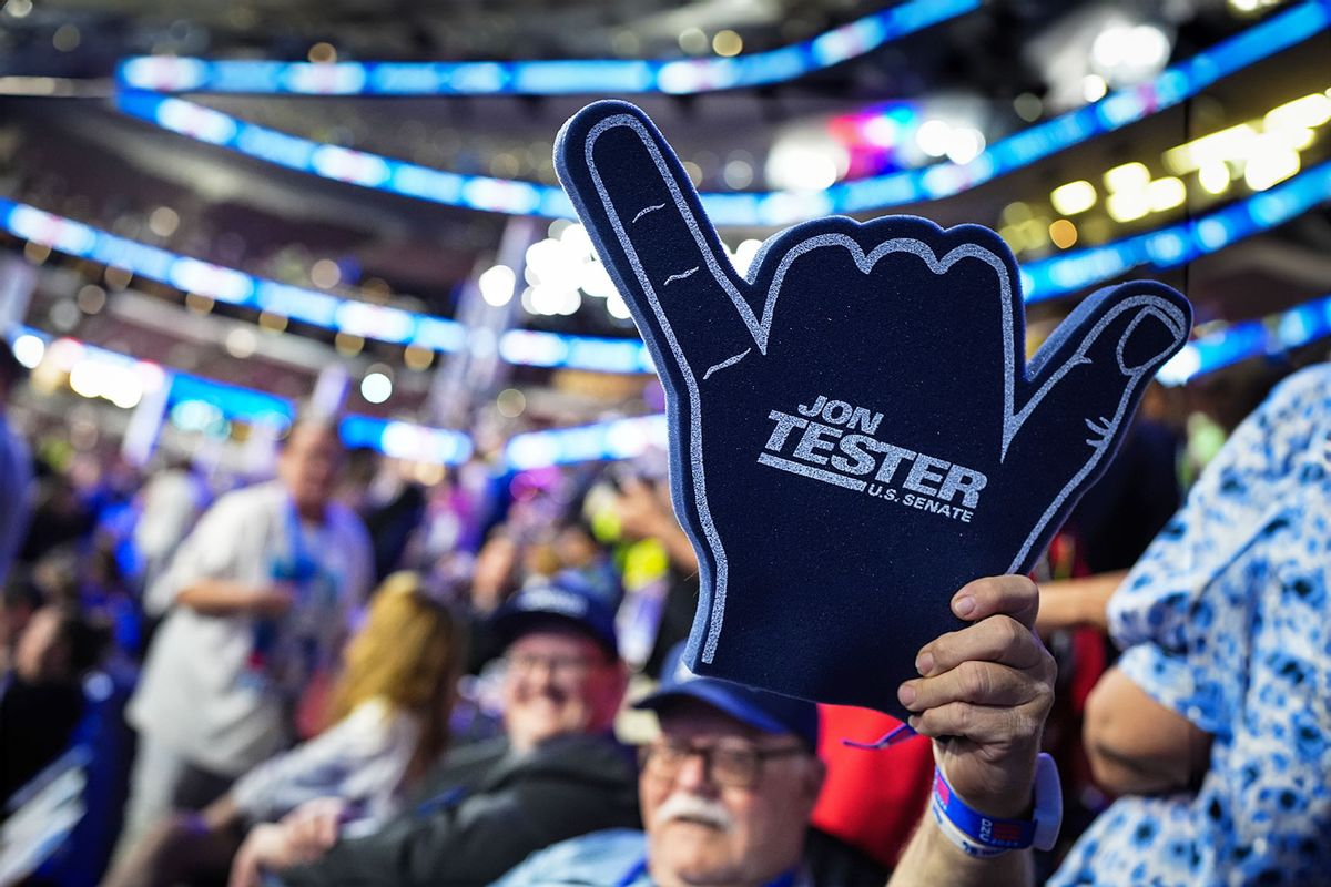 An attendee holds up sign supporting U.S. Sen. Jon Tester (D-MT) during the second day of the Democratic National Convention at the United Center on August 20, 2024 in Chicago, Illinois. (Andrew Harnik/Getty Images)