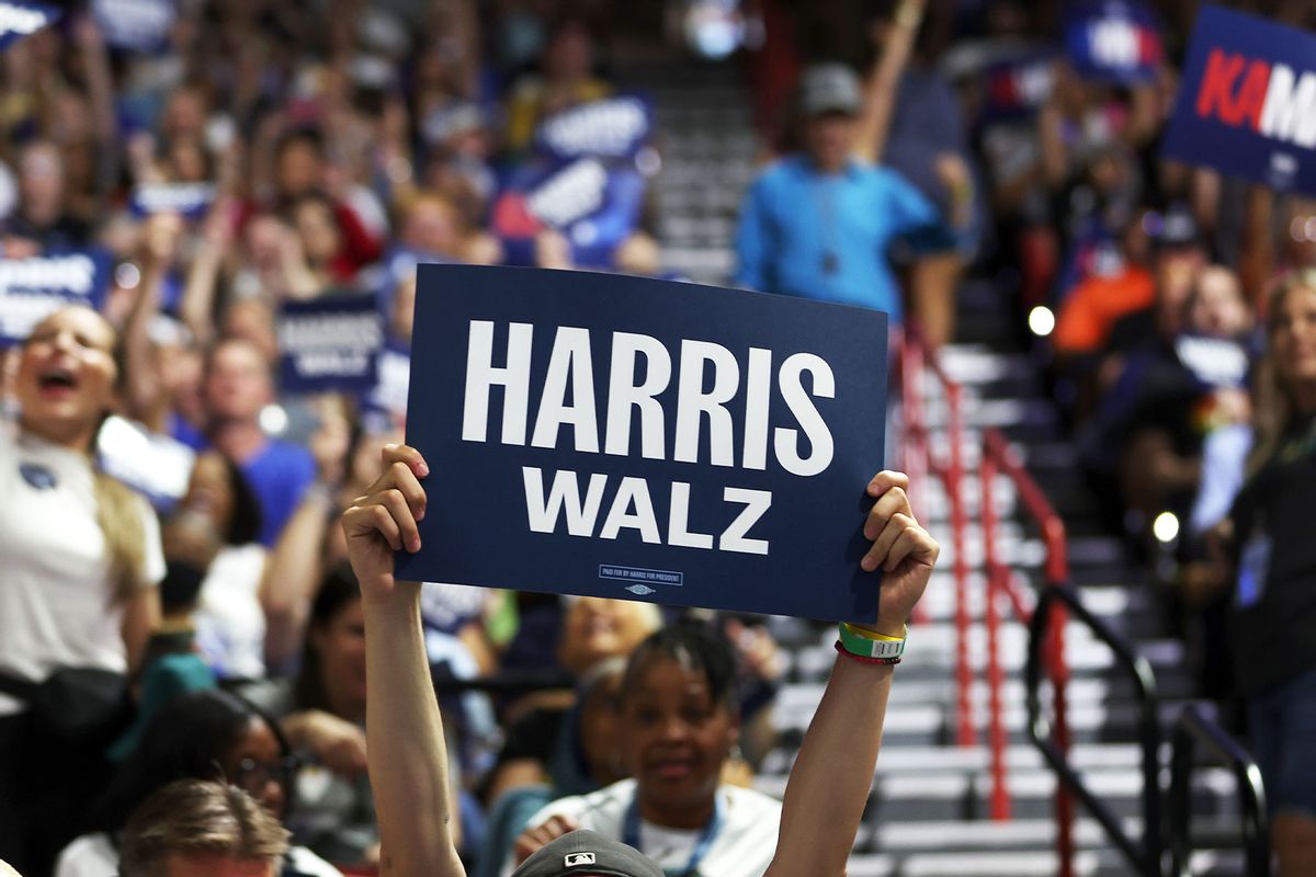 Supporters of Democratic presidential candidate, U.S. Vice President Kamala Harris and Democratic vice presidential candidate Minnesota Governor Tim Walz hold signs during a campaign rally at the University of Las Vegas Thomas & Mack Center on August 10, 2024 in Las Vegas, Nevada. (Justin Sullivan/Getty Images)