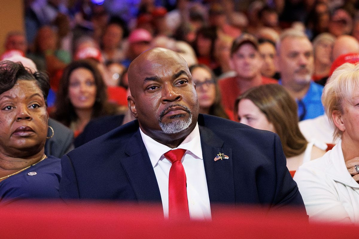 North Carolina Lt. Governor Mark Robinson sits with his wife, Yolanda Hill Robinson, during a campaign event for Republican presidential nominee Donald Trump inside Harrah's Cherokee Center in Asheville, North Carolina, on August 14, 2024. (Tom Brenner for The Washington Post via Getty Images)