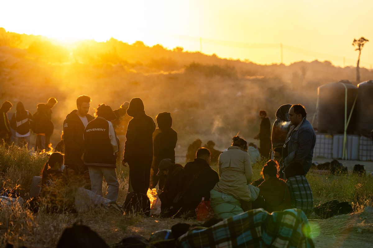 Migrants wait to be processed by U.S. Border Patrol agents after crossing into the U.S. from Mexico on June 14, 2024 in Jacumba Hot Springs, California. (Qian Weizhong/VCG via Getty Images)