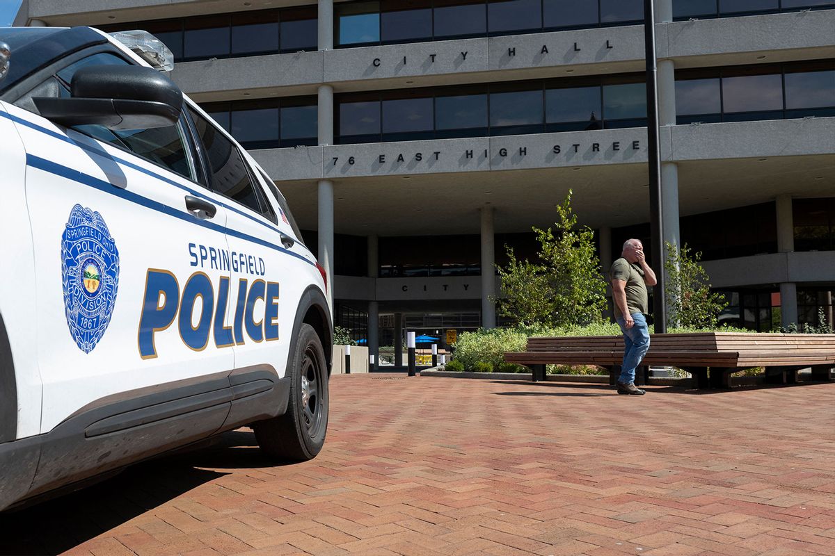 A man walks past the Springfield City Hall after bomb threats were made against buildings earlier in the day in Springfield, Ohio on September 12, 2024. (ROBERTO SCHMIDT/AFP via Getty Images)