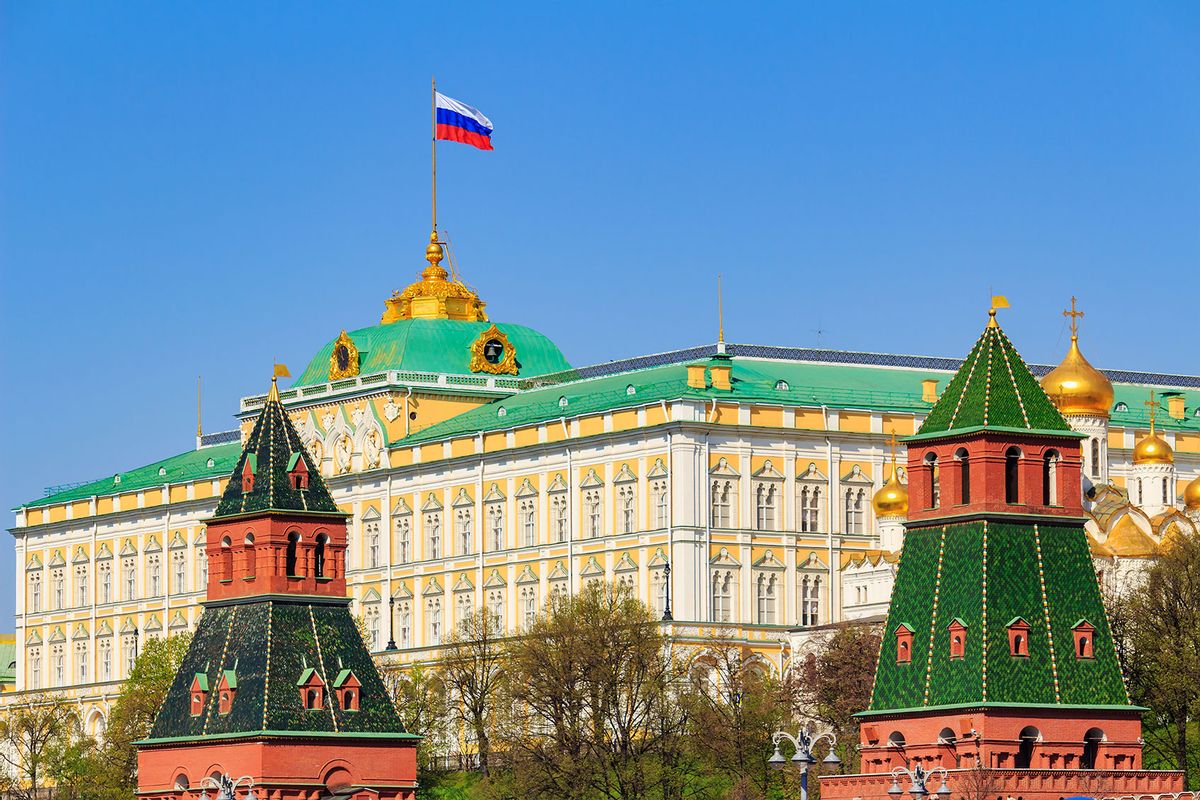 Building of Grand Kremlin Palace with waving flag of Russian Federation on the roof against Moscow Kremlin towers on a blue sky background (Getty Images/Fotokot197)