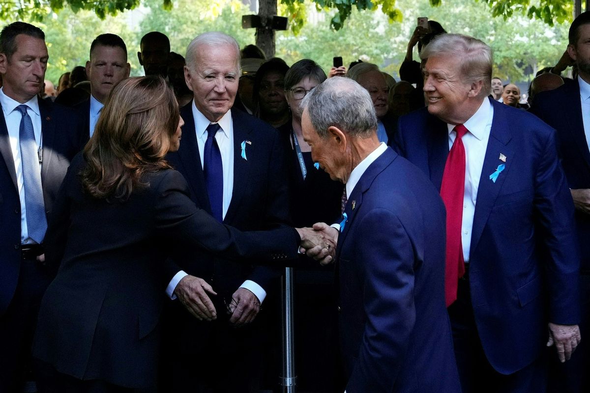 US Vice President and Democratic presidential candidate Kamala Harris shakes hands with former US President and Republican presidential candidate Donald Trump as former Mayor of New York Michael Bloomberg and US President Joe Bidenl ook on during a remembrance ceremony on the 23rd anniversary of the September 11 terror attack on the World Trade Center. (Photo by Adam GRAY / AFP) (Getty Images)