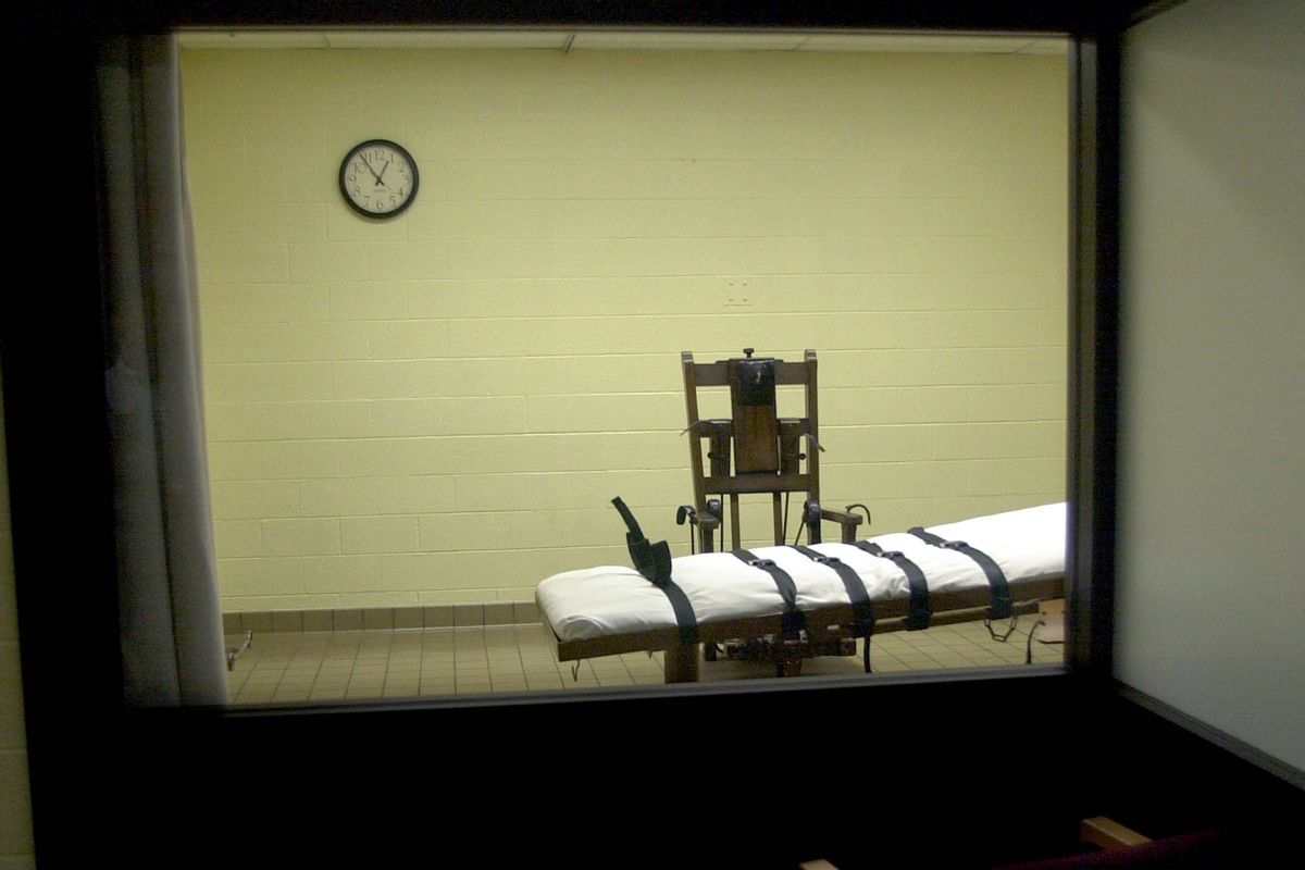 A view of the death chamber from the witness room at the Southern Ohio Correctional Facility shows an electric chair and gurney August 29, 2001 in Lucasville, Ohio. The state of Ohio is one of the few states that still uses the electric chair, and it gives death row inmates a choice between death by the electric chair or by lethal injection. John W. Byrd, who will be executed on September 12, 2001, has stated that he will choose the electric chair. (Photo by Mike Simons/Getty Images)