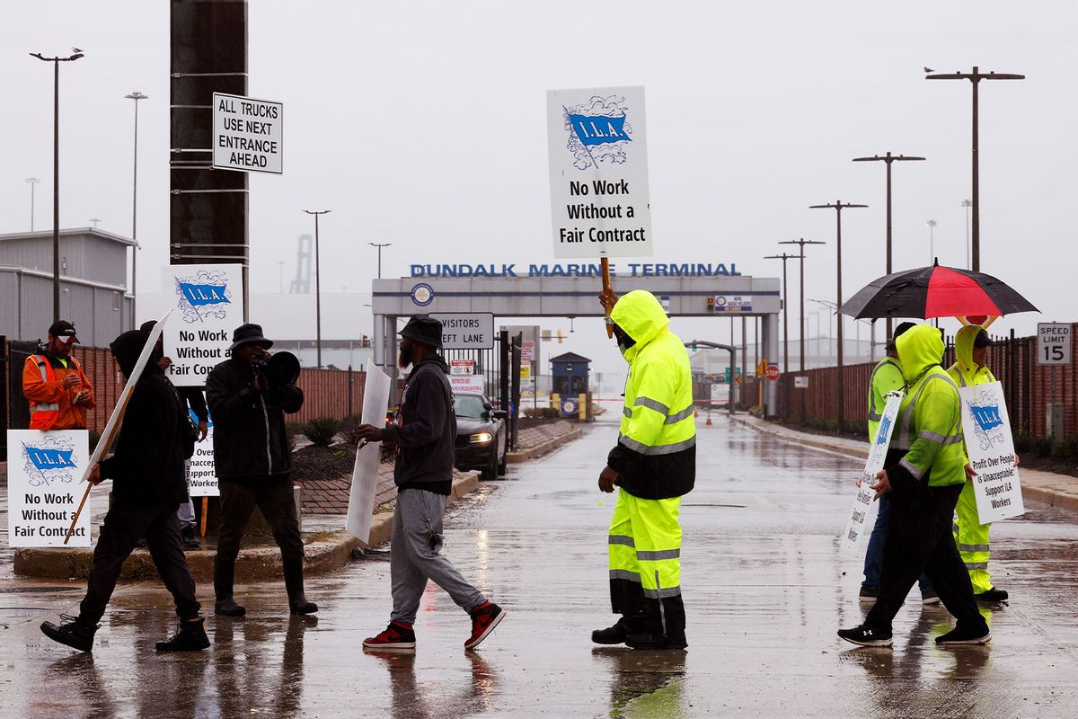 Longshoremen with the International Longshoremen’s Association (ILA) and their supporters picket outside of the Dundalk Marine Terminal at the Port of Baltimore on October 01, 2024 in Baltimore, Maryland. (Kevin Dietsch/Getty Images)