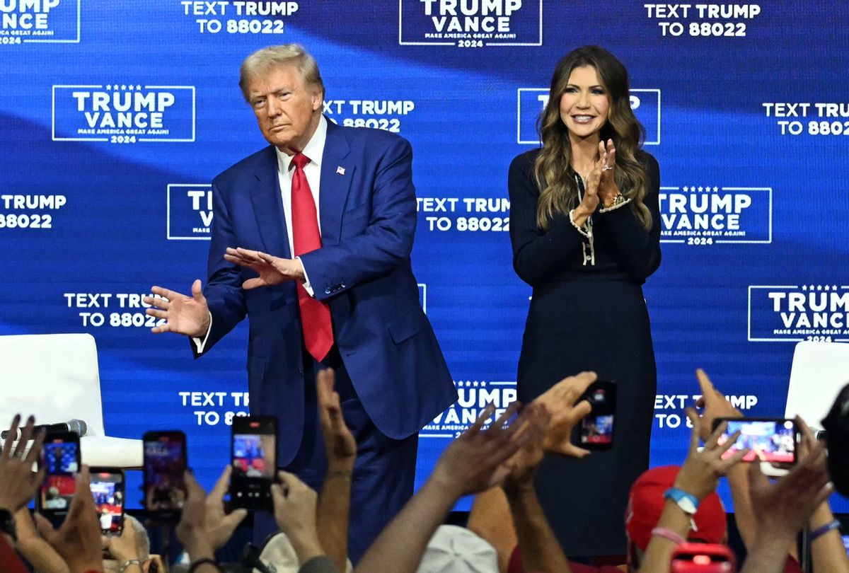 Former President and Republican presidential candidate Donald Trump, with moderator and South Dakota Governor Kristi Noem (R), at a town hall at the Greater Philadelphia Expo Center and Fairgrounds in Oaks, Pennsylvania, on October 14, 2024.  (JIM WATSON/AFP via Getty Images)