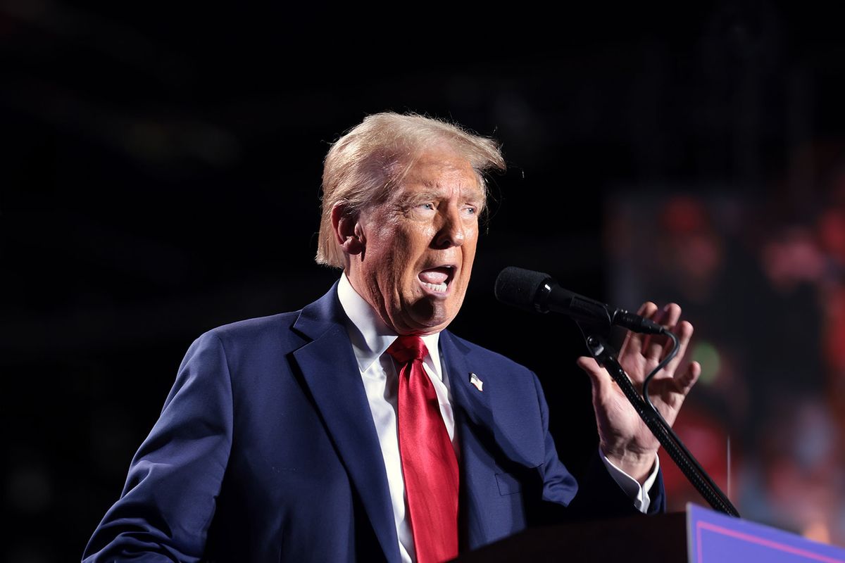 Republican presidential nominee, former U.S. President Donald Trump, brings boxing legend Thomas Hearns to the stage during a campaign rally on October 18, 2024, in Detroit, Michigan. (Win McNamee/Getty Images)