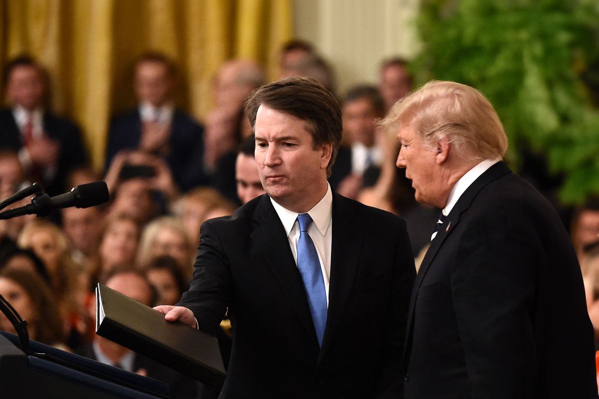 Brett Kavanaugh (L) takes the podium after US President Trump to speak during his swearing-in ceremony as Associate Justice of the US Supreme Court at the White House in Washington, DC October 8, 2018. (BRENDAN SMIALOWSKI/AFP via Getty Images)