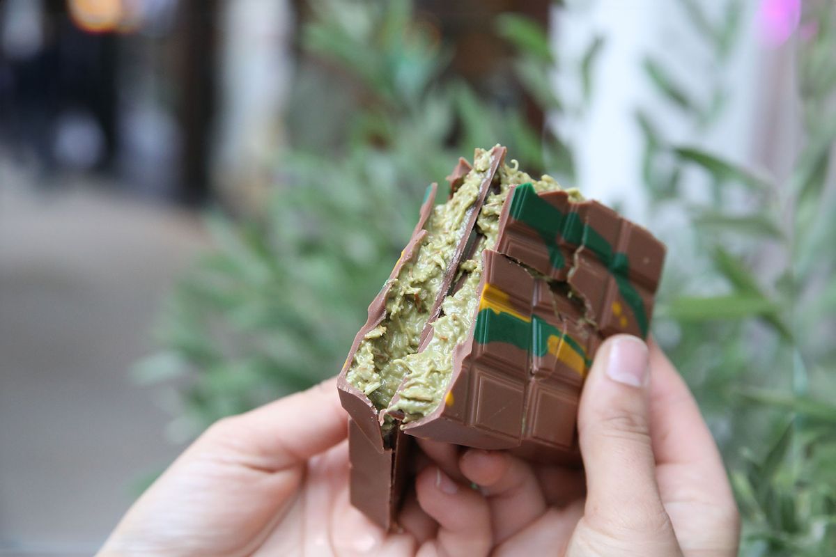 A broken bar of the "Dubai chocolate" produced by "Kikis Kitchen". With a pistachio kadayif filling, this chocolate is creamy and crunchy at the same time. (Sascha Thelen/picture alliance via Getty Images)