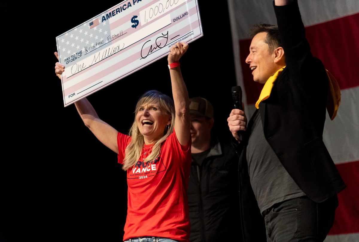 SpaceX and Tesla founder Elon Musk awarded Kristine Fishell with a $1 million check during the town hall at the Roxain Theater on October 20, 2024 in Pittsburgh, Pennsylvania.  (Michael Swensen/Getty Images)