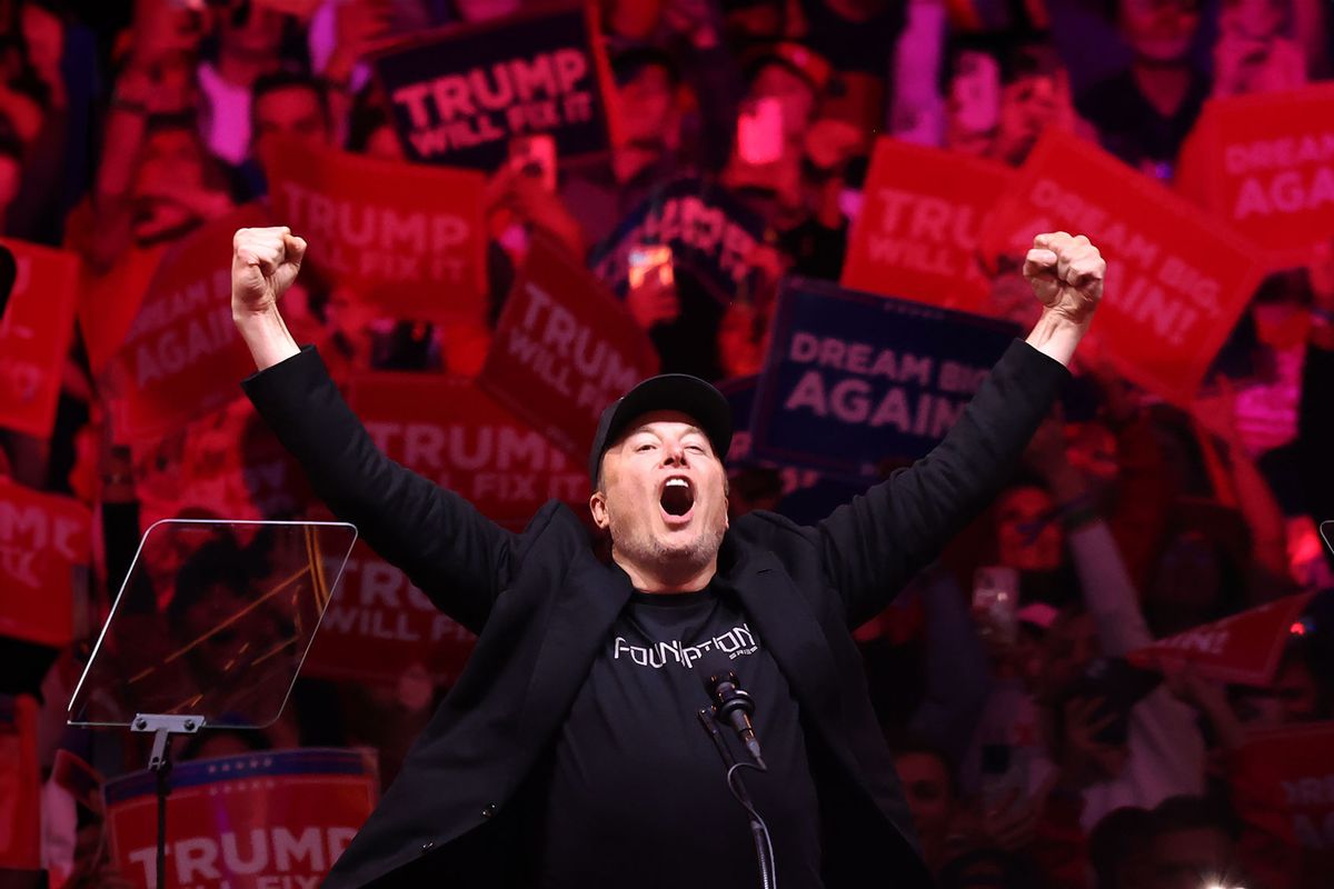 Tesla and X CEO Elon Musk raises his hands as he takes the stage during a campaign rally for Republican presidential nominee, former U.S. President Donald Trump, at Madison Square Garden on October 27, 2024 in New York City. (Michael M. Santiago/Getty Images)