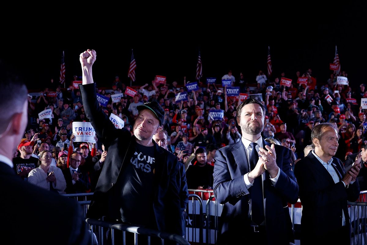 Elon Musk and Republican vice presidential candidate Sen. JD Vance listen as Republican presidential nominee, former President Donald Trump speaks at a campaign rally at the Butler Farm Show fairgrounds on October 05, 2024 in Butler, Pennsylvania. (Anna Moneymaker/Getty Images)