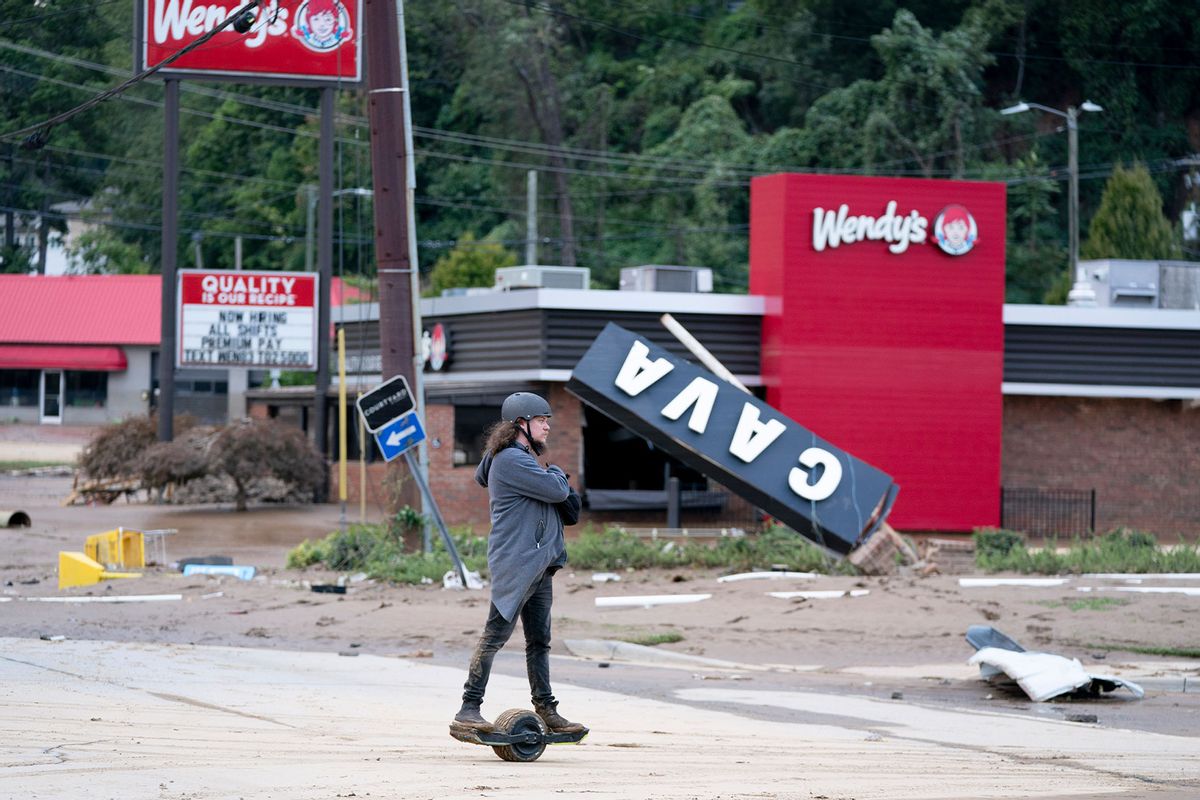 Kyle Gardner explorers storm damage near the Biltmore Village in the aftermath of Hurricane Helene on September 28, 2024 in Asheville, North Carolina. (Sean Rayford/Getty Images)