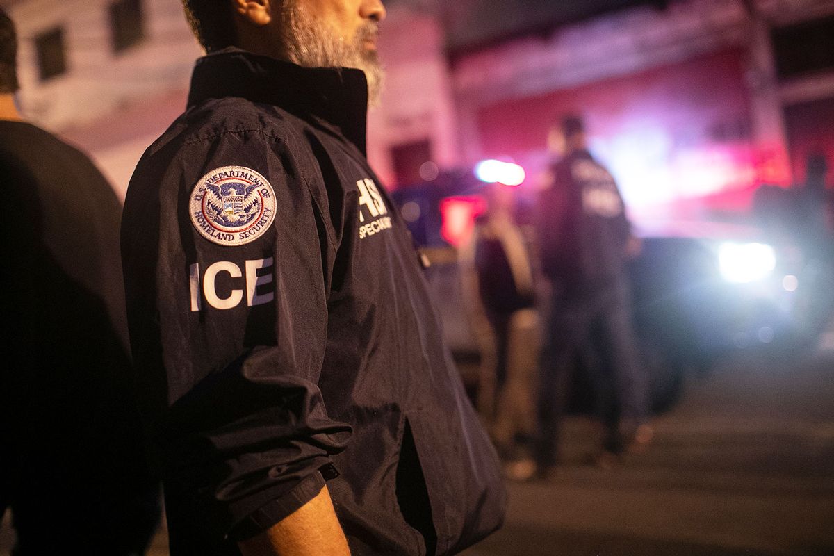 An ICE agent with U.S. Homeland Security Investigations (HSI), watches as Guatemalan police investigate the scene after detaining a suspected human trafficker on May 29, 2019 in Guatemala City. (John Moore/Getty Images)