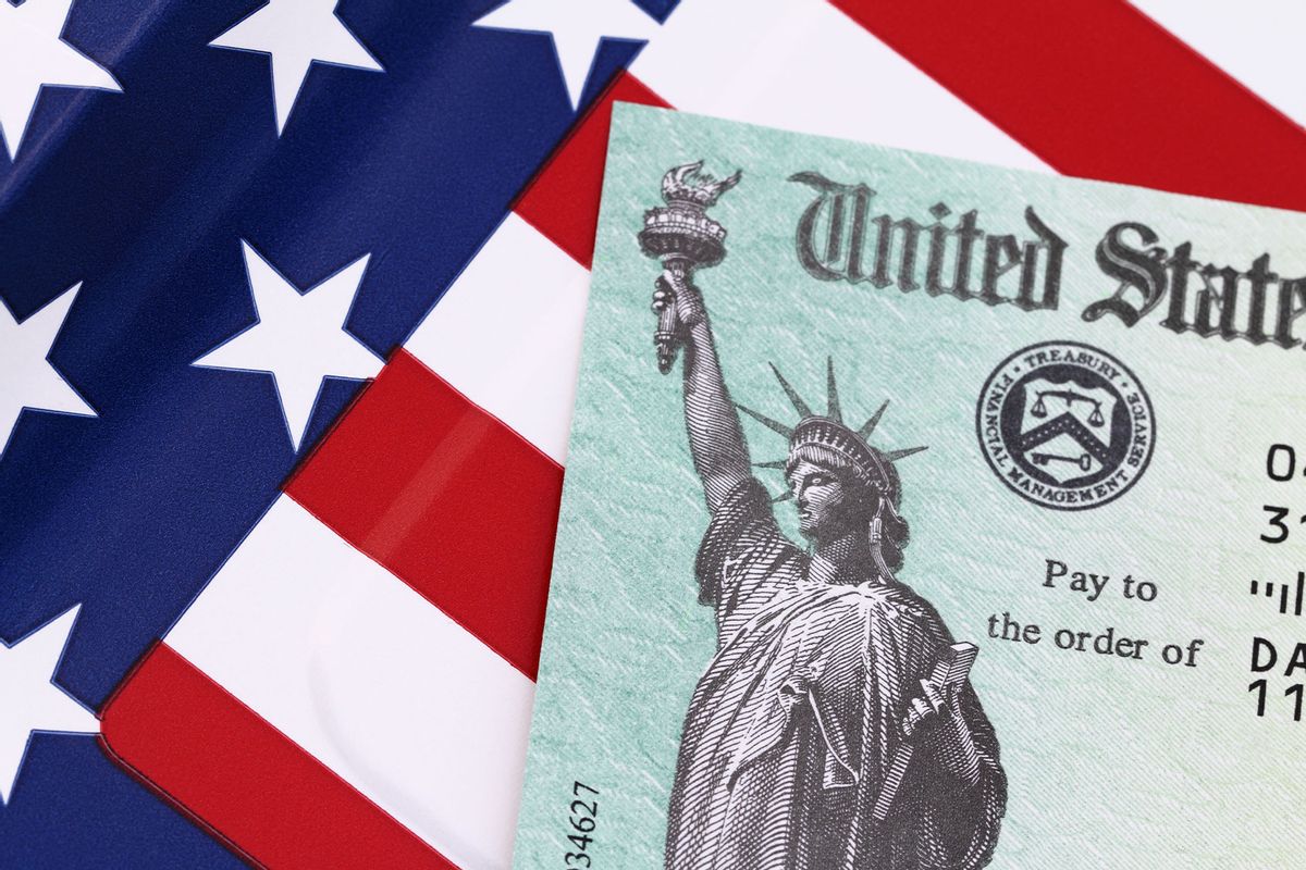 IRS tax refund check on an American Flag (Getty Images/NoDerog)