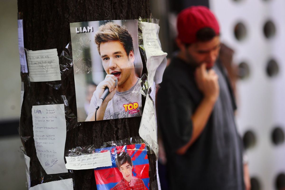 A portrait of Liam Payne is seen placed on a tree outside Casa Sur Hotel on October 17, 2024 in Buenos Aires, Argentina.  (Marcos Brindicci/Getty Images)