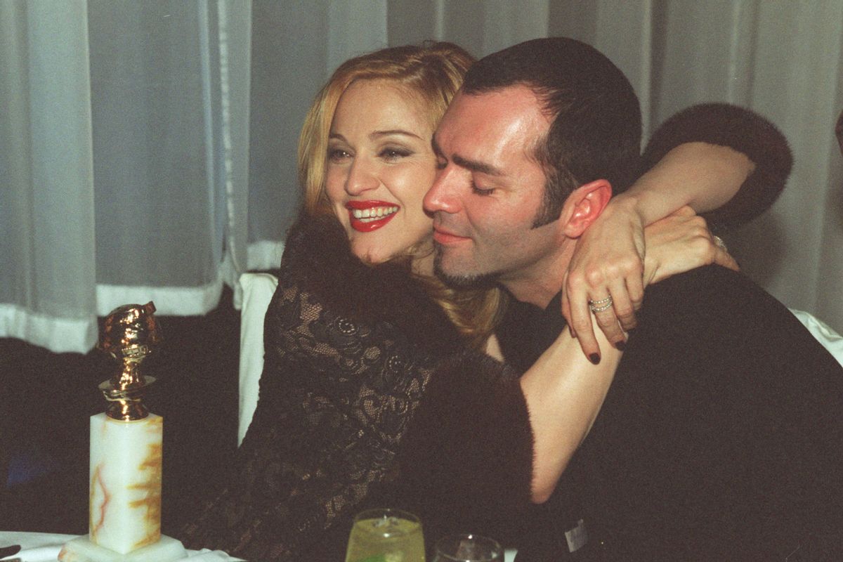 Madonna, winner of Golden Globe for Best Actress in Motion Picture Musical or Comedy with her brother Christopher Ciccone at the Disney party following awards ceremony. (Gary Friedman/Los Angeles Times via Getty Images)