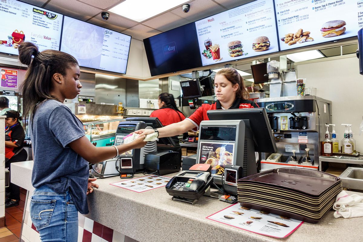 Florida, Vero Beach, McDonald's Fast Food restaurant Cashier giving change to Customer. (Jeffrey Greenberg/Universal Images Group via Getty Images)