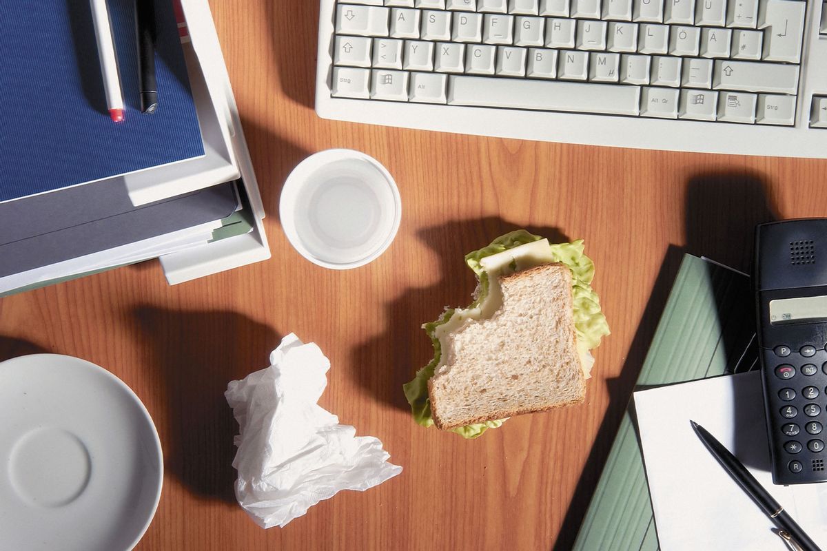 Office desk with a sandwich (Getty Images/Image Source)