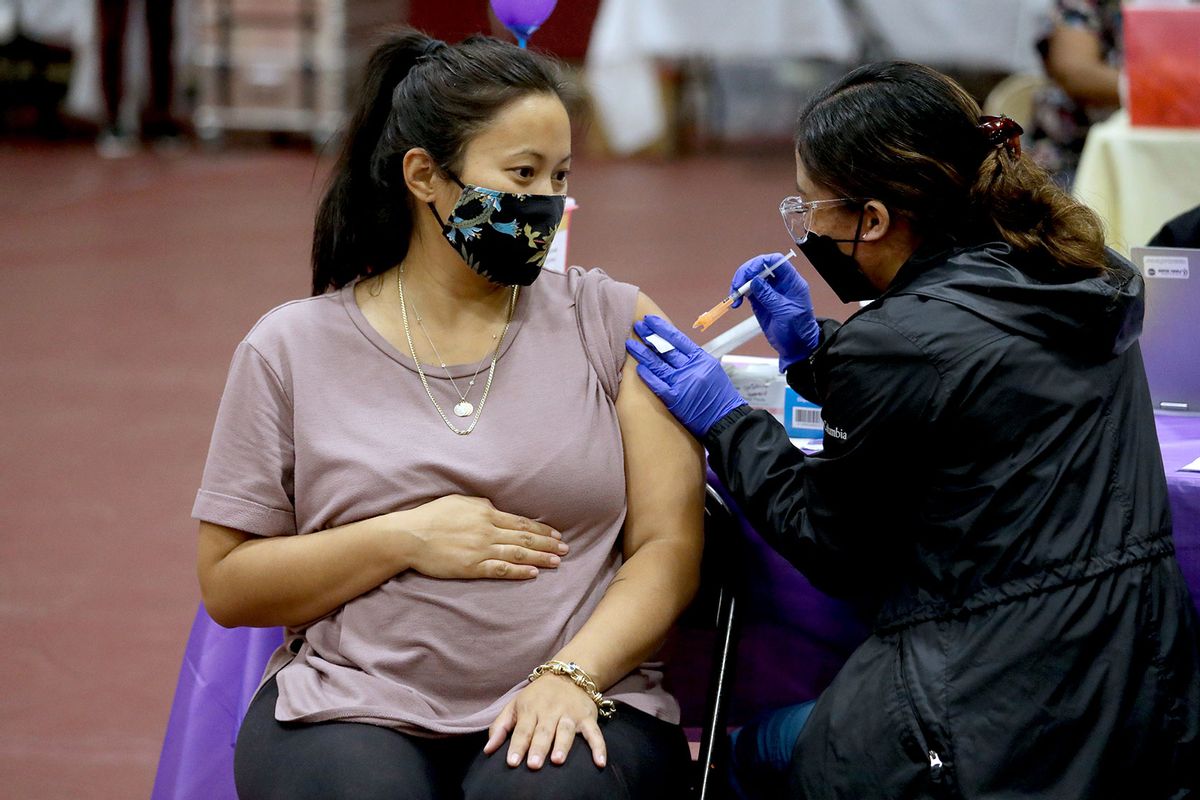 Nicole Fahey, six months pregnant, receives a Pfizer vaccination booster shot on Wednesday, Nov. 3, 2021 in Los Angeles, CA.  (Gary Coronado / Los Angeles Times via Getty Images)
