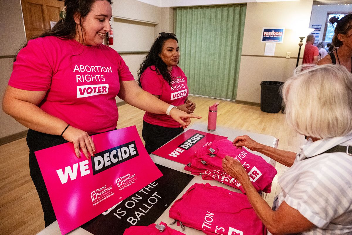 Signs supporting the Right to Abortion Initiative are displayed during a rally on September 5, 2024 in Bozeman, Montana. The initiative will be on the November 5th ballot as an amendment to Montana's constitution. (William Campbell/Getty Images)