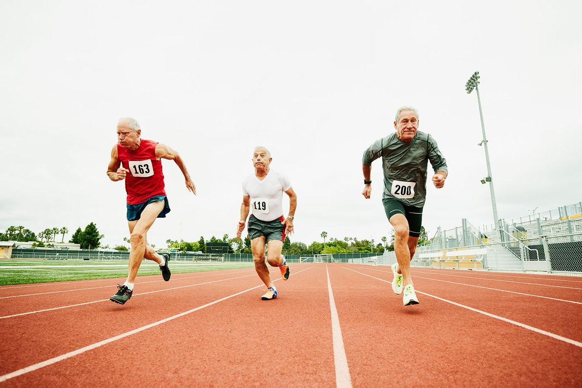 Senior male track athletes running sprint on track during race (Getty Images/Thomas Barwick)
