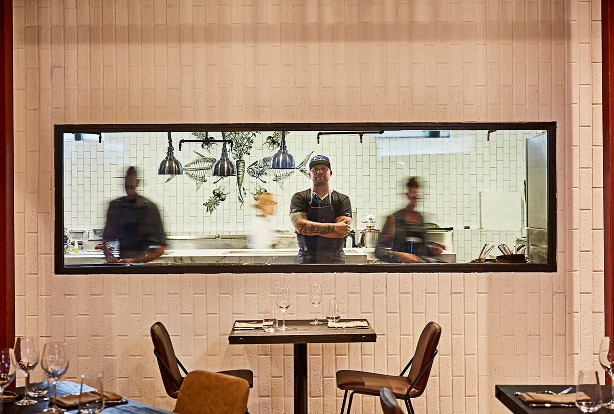 Chef Jeremy Ford standing in the chef window at the restaurant Stubborn Seed. (Grove Bay Hospitality Group)