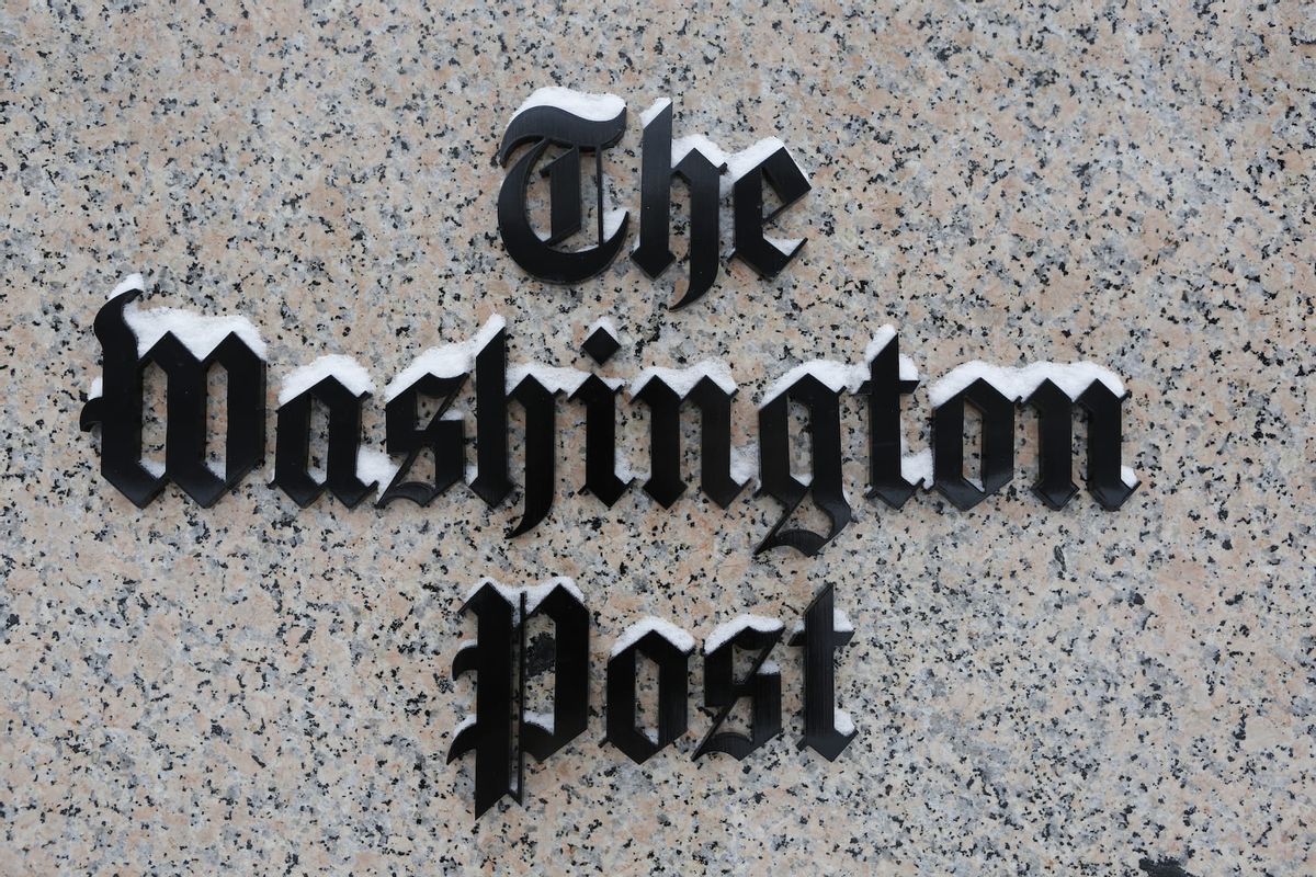 Washington Post logo outside of the building covered with snow. (Photo by Oliver Contreras/For The Washington Post via Getty Images)