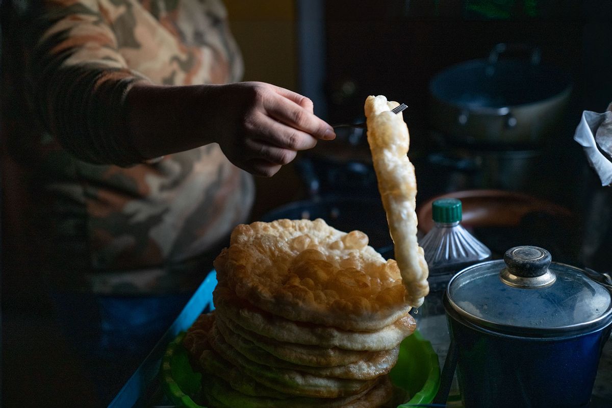 Young Navajo Woman Cooking Fry Bread (Getty Images/grandriver)