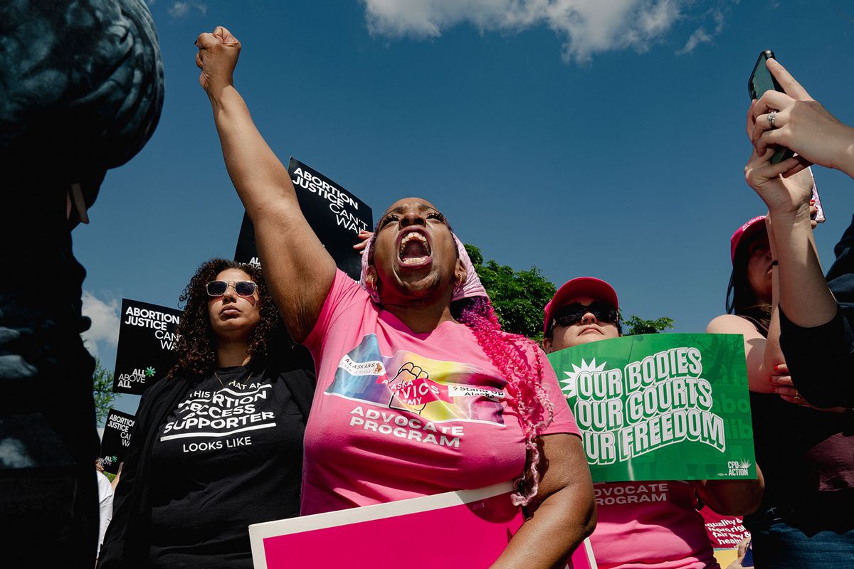 Abortion rights advocates protest during arguments over whether the federal government has the power to penalize hospitals that fail to provide emergency abortions even in states with strict bans on the procedure outside the Supreme Court in Washington, DC, on April 24, 2024. (Shuran Huang for The Washington Post via Getty Images)